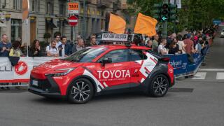 Giro d'Italia sponsors teams at the great cycling race, with technical support teams and cars. pink sweater, tour of italy 2024, turin, italy, 4 may 2