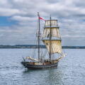 Classic maritime vessel in serene seascape.