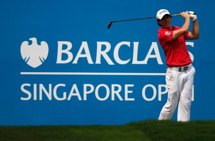 Rory McIlroy of Northern Ireland tees off on the 9th hole during the first round of the Barclays Singapore Open golf tournament in Sentosa November 8, 2012. REUTERS/Edgar Su (SINGAPORE - Tags: SPORT GOLF)