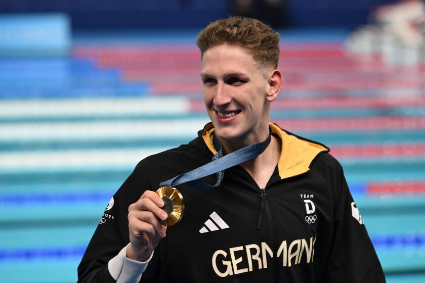 27th July 2024; Paris Olympic Games, Paris, France, Day 2; Swimming, Aquatics Centre, Arena De La Defense, Mens 400m freestyle final, Lukas Maertens of Germany receives the Gold Medal