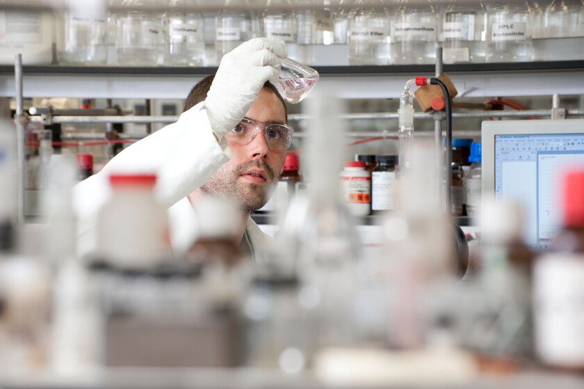 male laboratory technician working in lab