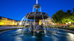 Stuttgart Schlossplatz with fountain and Neues Schloss travel by night in Germany