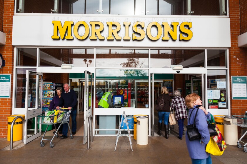 Customers entering and leaving a Morrisons Supermarket.