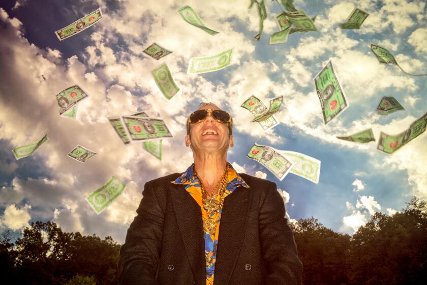 A man standing outside with money falling all around him