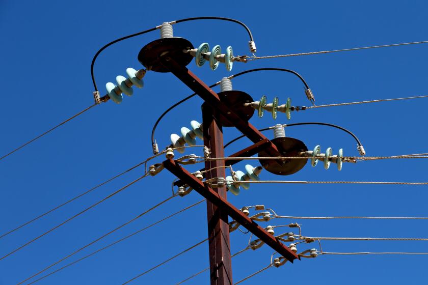 in  australia the concept of power line with electrical pole in the clear sky