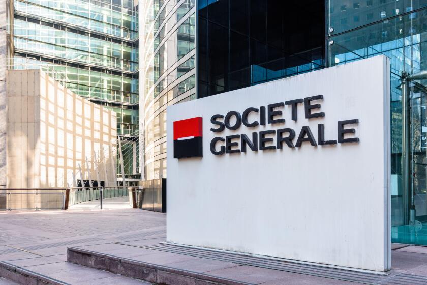 Sign of the Societe Generale at the entrance of the head office of the french banking group in La Defense business district.