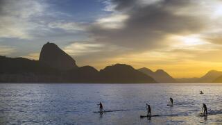 Pratica de SUP Stand Up Paddle na Praia de Copacabana ao amanhecer. Image shot 07/2015. Exact date unknown.