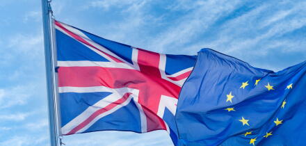 EU, European Union flag and flag of UK, United Kingdom