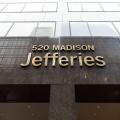 Jefferies Group LLC headquarters entrance sign at 520 Madison Avenue, Midtown Manhattan, New York City, USA