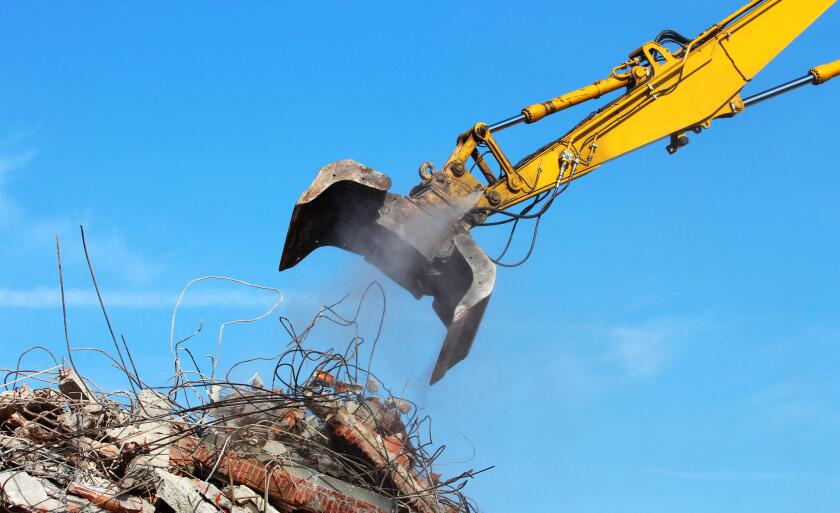 Demolition crane dismantling a building