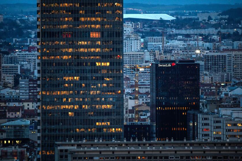 Lyon (central-eastern France): La Part-Dieu District at night. Skyscrapers (Incity and Swiss Life Towers) with lit up buildings