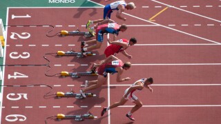 sprinters coming out of their starting blocks one of them too fast. Image shot 2003. Exact date unknown.