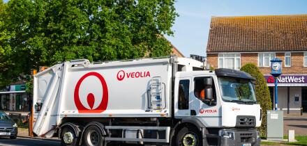 Veolia waste management vehicle, truck, lorry or dust cart on a road in England, UK.