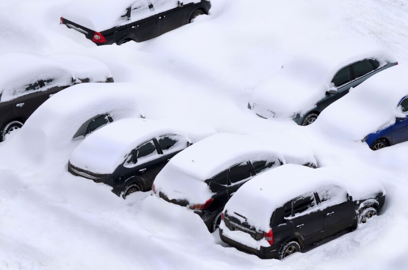 Snow covered car parking lot