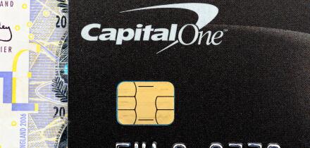 A Capital one credit card close up showing chip and pin contact England UK