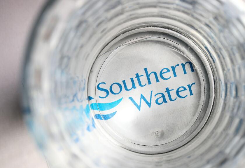 Southern Water bill with a glass of water