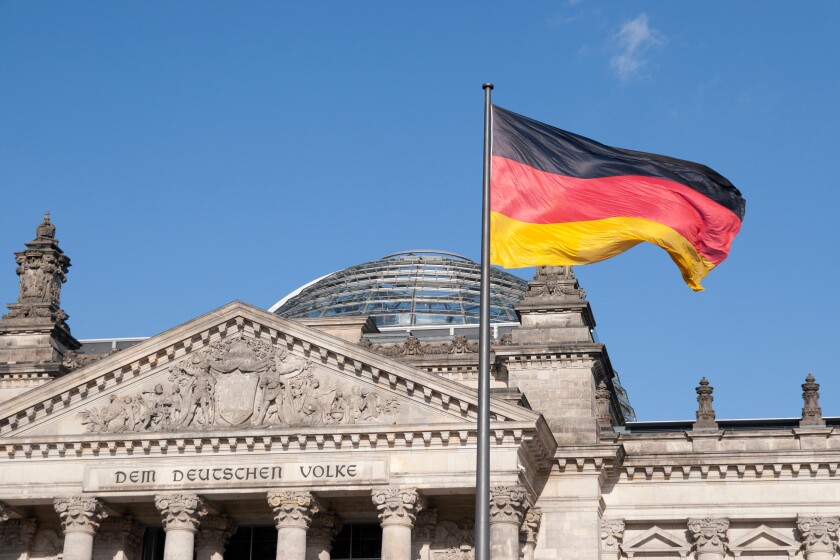 German Flag in front of Reichstag Berlin Germany. Image shot 2010. Exact date unknown.