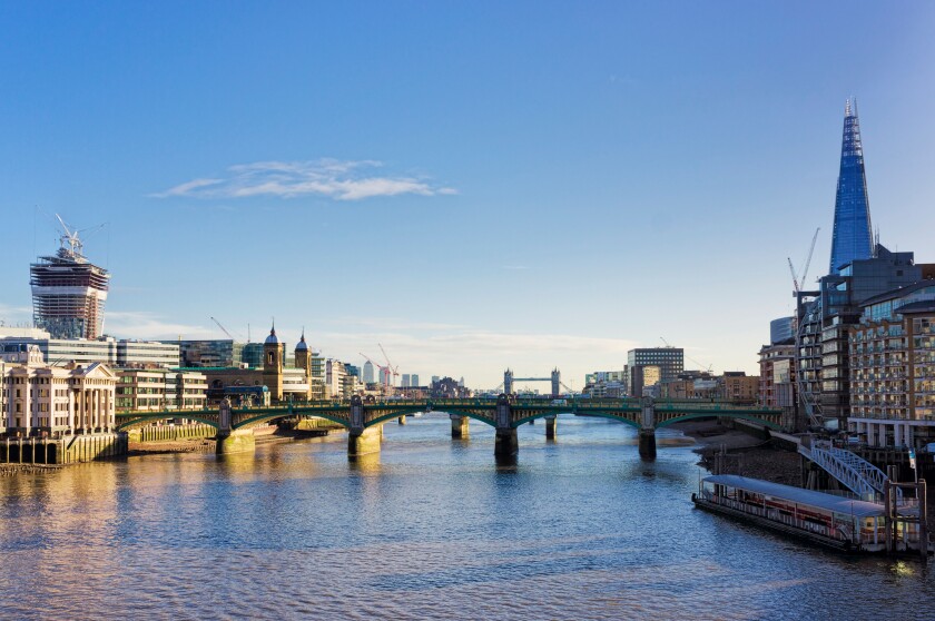 Southwark bridge over The River Thames and the city of London, England, UK - with the Shard