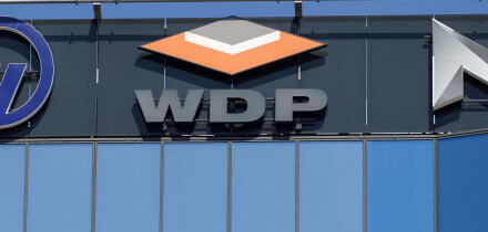Bucharest, Romania - August 16, 2021: A logo of WDP, Warehouses De Pauw, Belgium logistics for warehouse rentals company, is displayed on the top of a