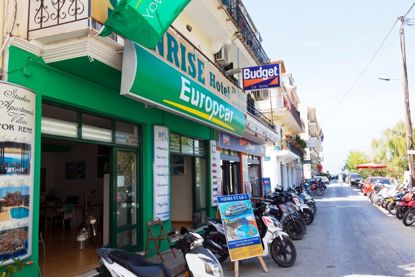 Europcar budget scooter hire shop fronts Lefkas town Lefkada Greek Island Greece