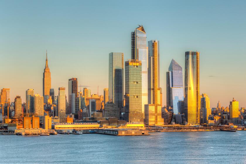The mixed-use Hudson Yards real estate development and other buildings on the West Side of Manhattan in New York City at sunset.