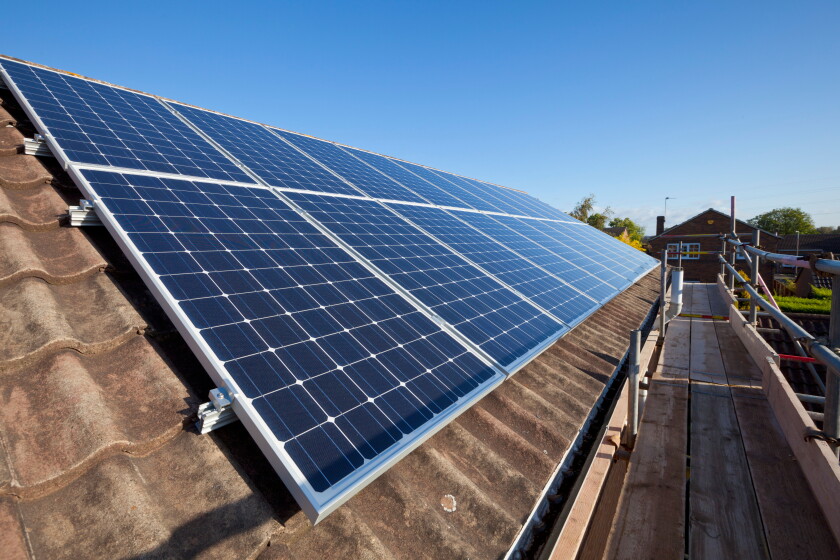 solar panels being installed on house roof england uk gb europe solar panels on roof uk