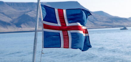 Icelandic flag flying on a boat.