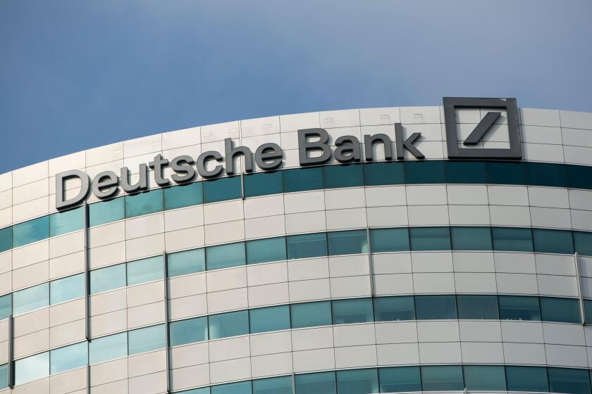 A logo sign outside of an office building occupied by Deutsche Bank in Amsterdam, Netherlands on October 4, 2015.