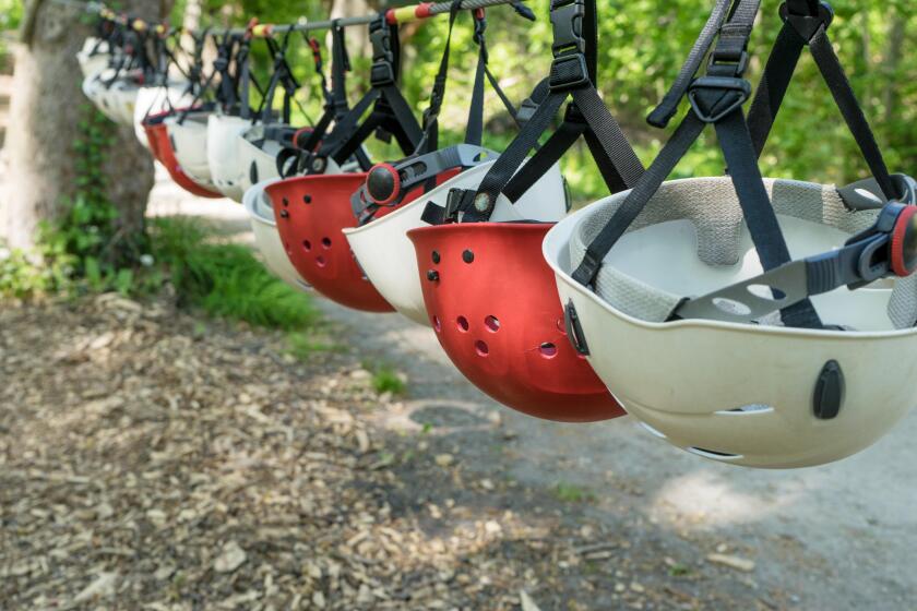 Row with red and white safety helmets