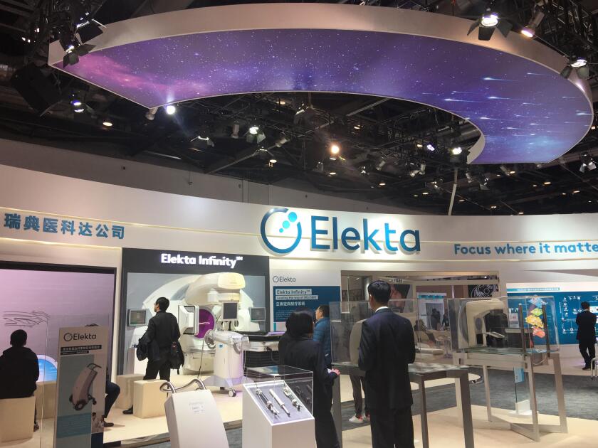 --FILE--People visit the stand of Elekta during an expo in Beijing, China, 25 March 2017.

The world's first high-field magnetic resonance-guided lin