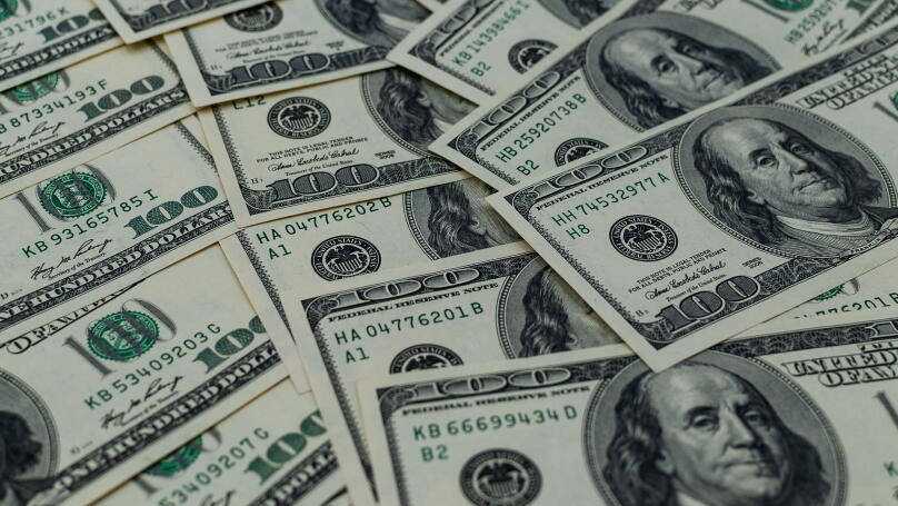 A multitude of laid-out and overlapping US hundred-dollar bills
