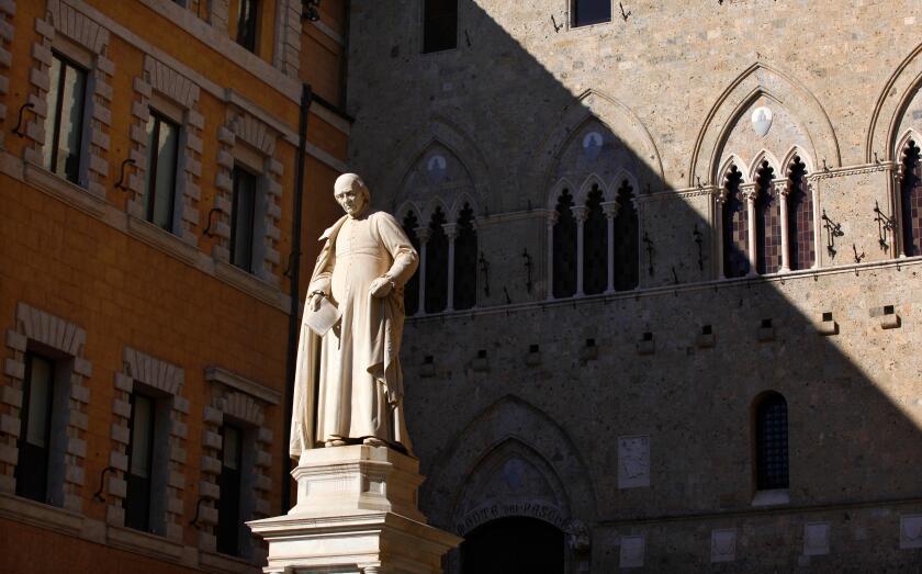The statue of Sallustio Bandini outside the headquarters of Monte dei Paschi di Siena bank in Siena, Italy.