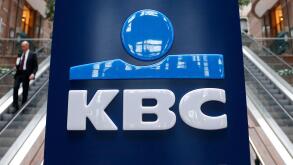 The logo of Belgian banking and insurance group KBC is seen at the entrance of the company's headquarters in Brussels February 14, 2013. Belgian financial group KBC beat expectations for quarterly profit, helped by a strong performance from its central Eu