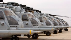 Military Helicopters lined up in a row