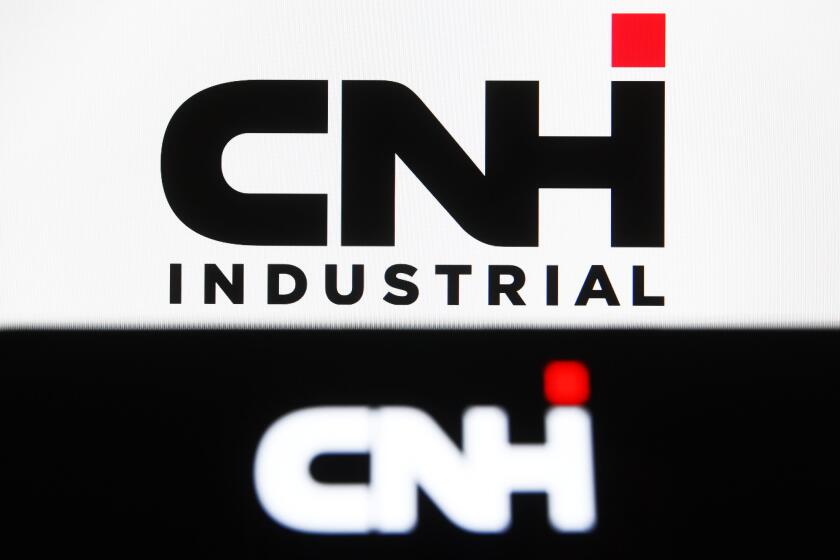 In this photo illustration, CNH Industrial logo seen displayed on a smartphone and a pc screen. (Photo by Pavlo Gonchar / SOPA Images/Sipa USA)