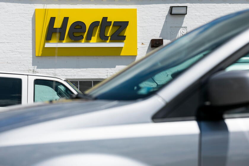 A logo sign outside of a Hertz car rental location in Silver Spring, Maryland on May 23, 2020.