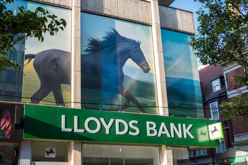 Lloyds bank with picture of black horse above the branch on Oxford street, London, England, U.K.
