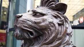 Bronze Lions stand Guard at the global headquarters of the HSBC Group in Canary Wharf London