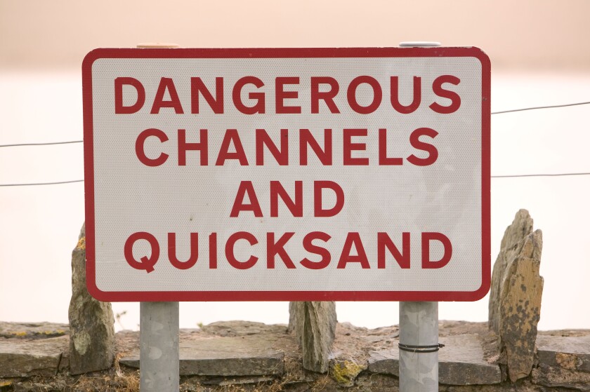 danger quicksnads sign on the Leven estuary near newby Bridge