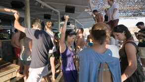 Mykonos, Greece. Tourists dancing at the Tropicana Club on Paradise Beach