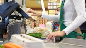 Cashier ringing up groceries