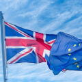 EU, European Union flag and flag of UK, United Kingdom