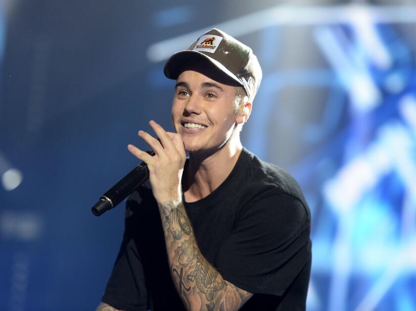 Justin Bieber performs on stage during the Capital FM Jingle Bell Ball 2015 held at The O2 Arena, London. 
Photo credit should read: Doug Peters EMPICS Entertainment
