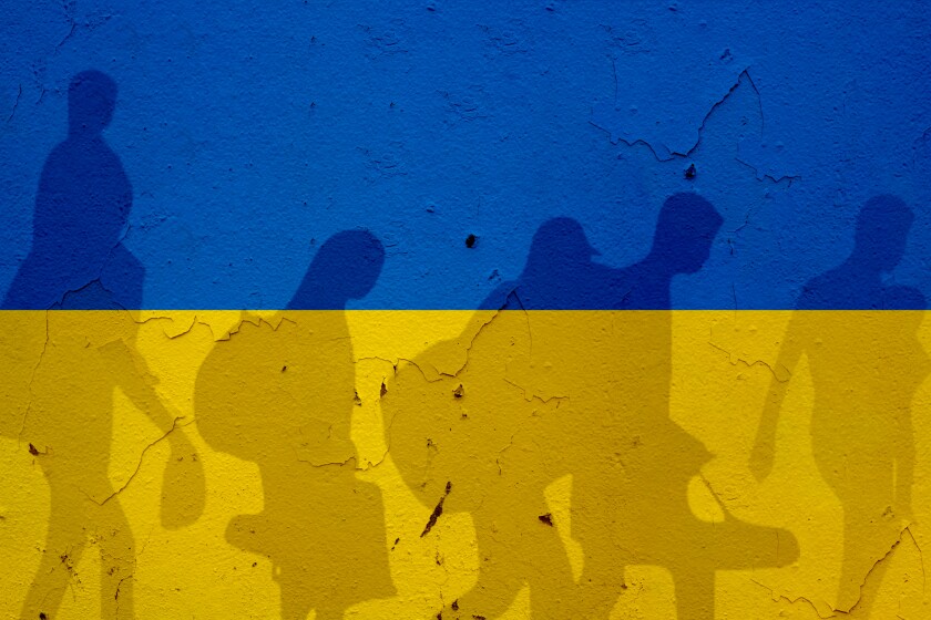 Ukraine,Flag,On,Wall,And,Refugee,Shadows.,Ukraine,War,Concept.