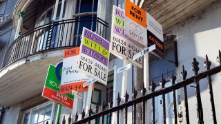 Estate Agents For Sale For Rent and Sold signs outsde Victorian houses in Pelham Crescent on the seafront in Hastings Sussex