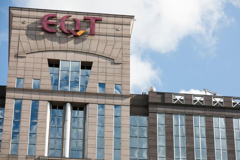 A logo sign outside of the headquarters of the EQT Corporation.