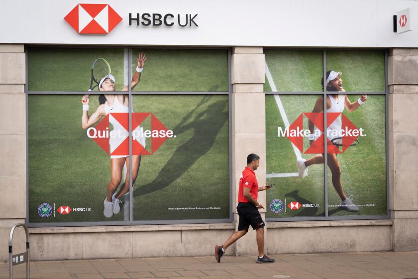 British tennis player, Emma Raducanu who is sponsored by HSBC appears on a giant billboard in Wimbledon town centre, during the first week of competition of the Wimbledon Lawn Tennis Association championships, on 30th June 2022, in London, England. Raduca