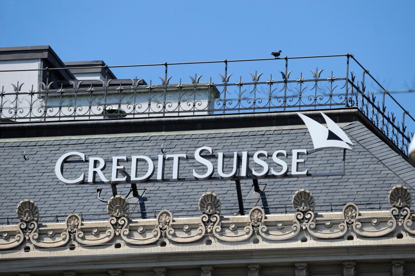 credit suisse logo at the roof of the headquarter in zuerich, switzerland.