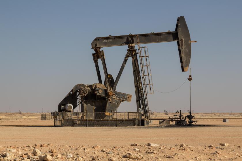 Crude oil drilling well pumping the black gold out of the soil of the Sultanate of Oman in the middle east