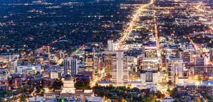 Aerial view of Utah State Capitol and Salt Lake City skyline at dusk. Salt Lake City, is the capital and most populous city of the U.S. state of Utah